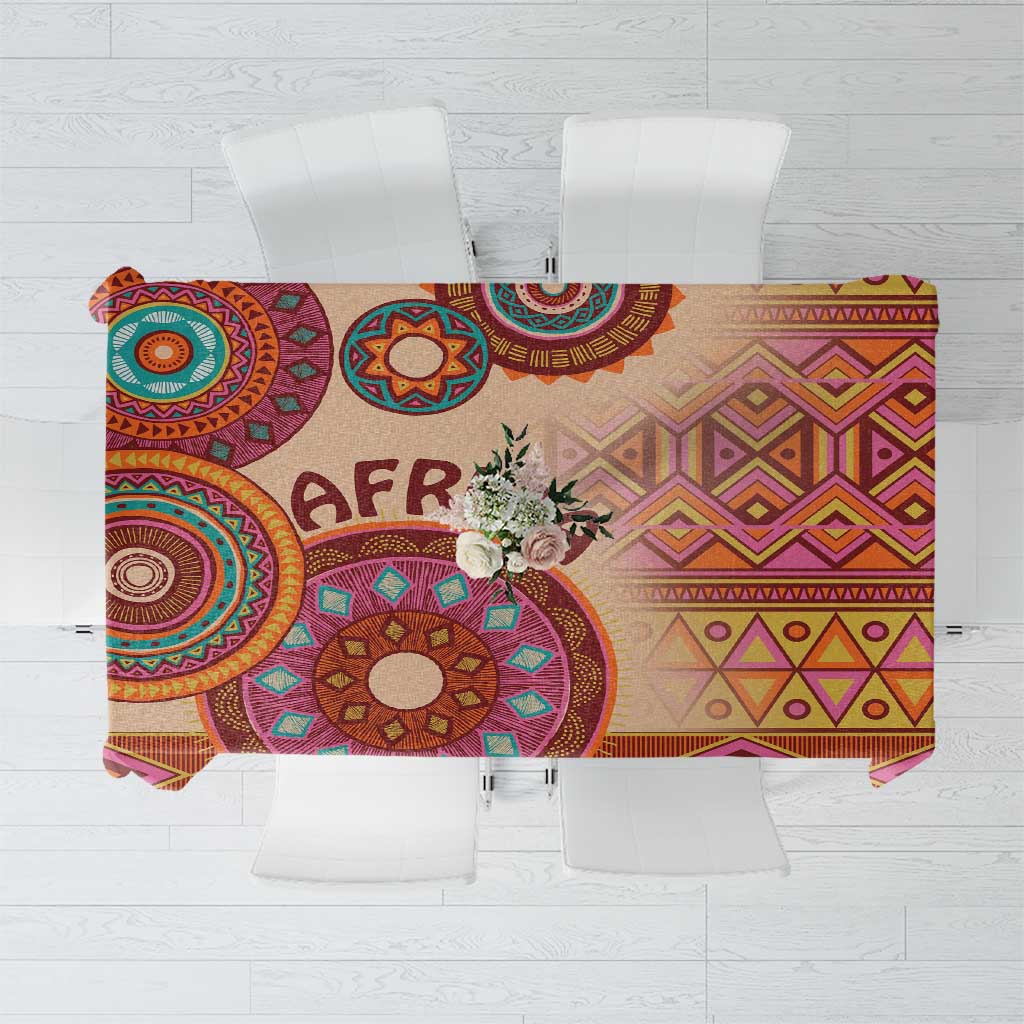 Beige tribal tablecloth with colorful circular and diamond motifs and 'AFRICA' print.