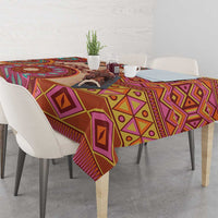 Beige base tribal tablecloth with bold purple, orange, and yellow geometric shapes.