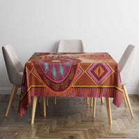 Geometric tribal tablecloth with purple and orange patterns on beige base.