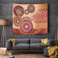 Beige wall tapestry with bold circular tribal motifs, 'AFRICA' text, and geometric lines