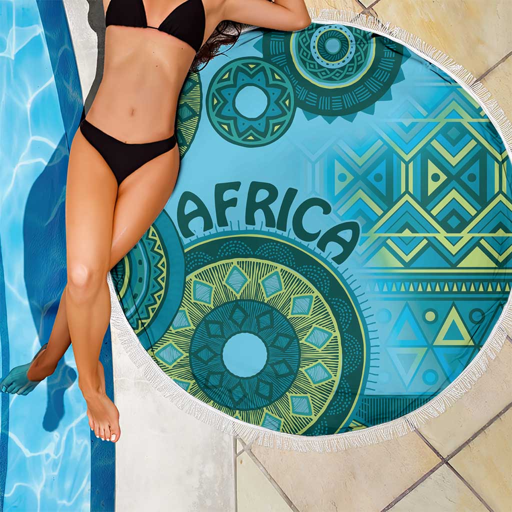Blue Africa tribal pattern round beach blanket with white fringe trim, poolside use