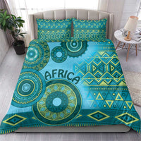 Turquoise tribal bedding set with "AFRICA" print and geometric bands on duvet and pillows