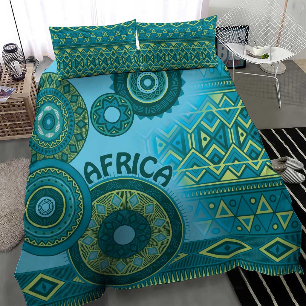 Turquoise tribal bedding set with "AFRICA" lettering and circular motifs across the duvet