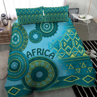 Turquoise tribal bedding set with "AFRICA" lettering and circular motifs across the duvet