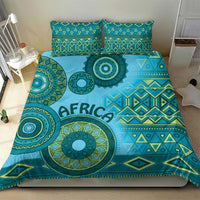 Turquoise tribal bedding set with oversized circular design and "AFRICA" text on the duvet