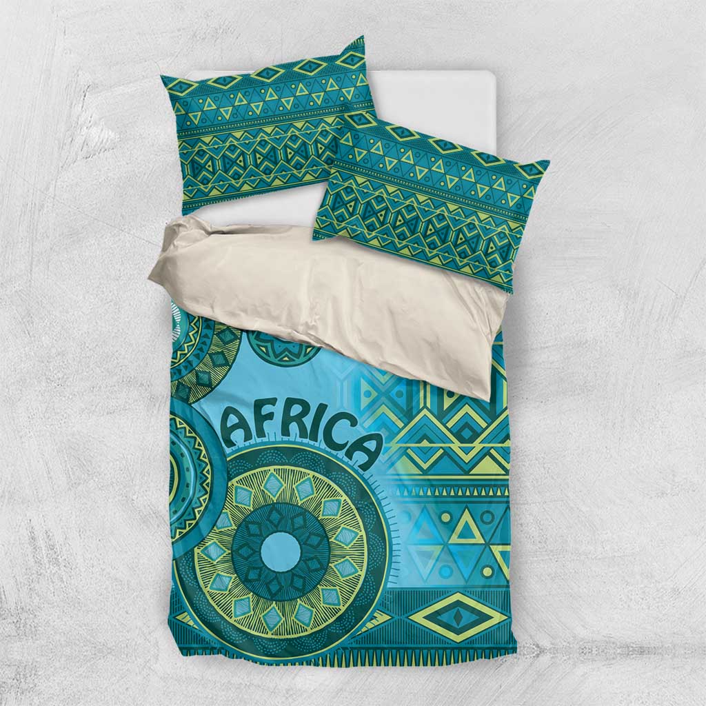 Turquoise tribal bedding set with two pillows and matching duvet, geometric and circular pattern