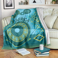 Blue tribal pattern throw blanket with teal circular motifs and geometric borders
