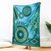 Blue tribal blanket with large circular medallions, teal shapes, and diamond accents