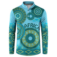 Blue button-up sweatshirt with green tribal circles and 'AFRICA' graphic, long sleeves