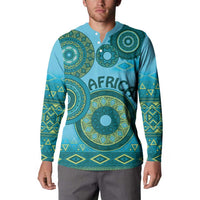 Blue button-up sweatshirt with green tribal circular print and patterned sleeve cuffs