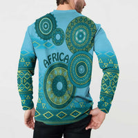 Blue button-up sweatshirt back with large green tribal circular motif and geometric sleeve bands
