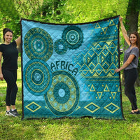 Large blue tribal quilt blanket with circular teal motifs, geometric diamonds, and “Africa”.