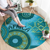 Blue round tribal pattern rug with bold medallion design, geometric shapes, and “AFRICA”
