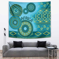 Blue tribal patterned wall tapestry with circular motifs, geometric stripes, and fringe