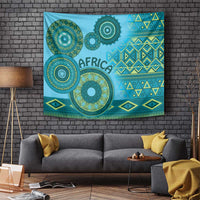 Blue tribal pattern wall tapestry featuring circular medallions, diamonds, and fringed trim