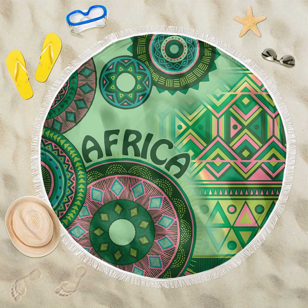 Round beach blanket with green and pink tribal circle motifs and 'AFRICA' lettering