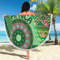 Fringed round beach blanket with green tribal design, 'AFRICA' text, pink and teal details