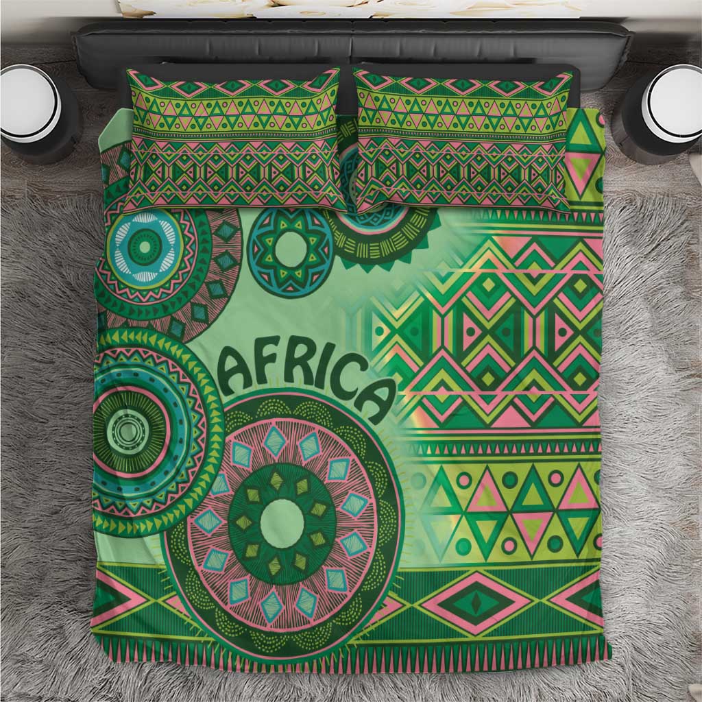 Green bedding set with two matching pillowcases and duvet featuring 'AFRICA' and motifs