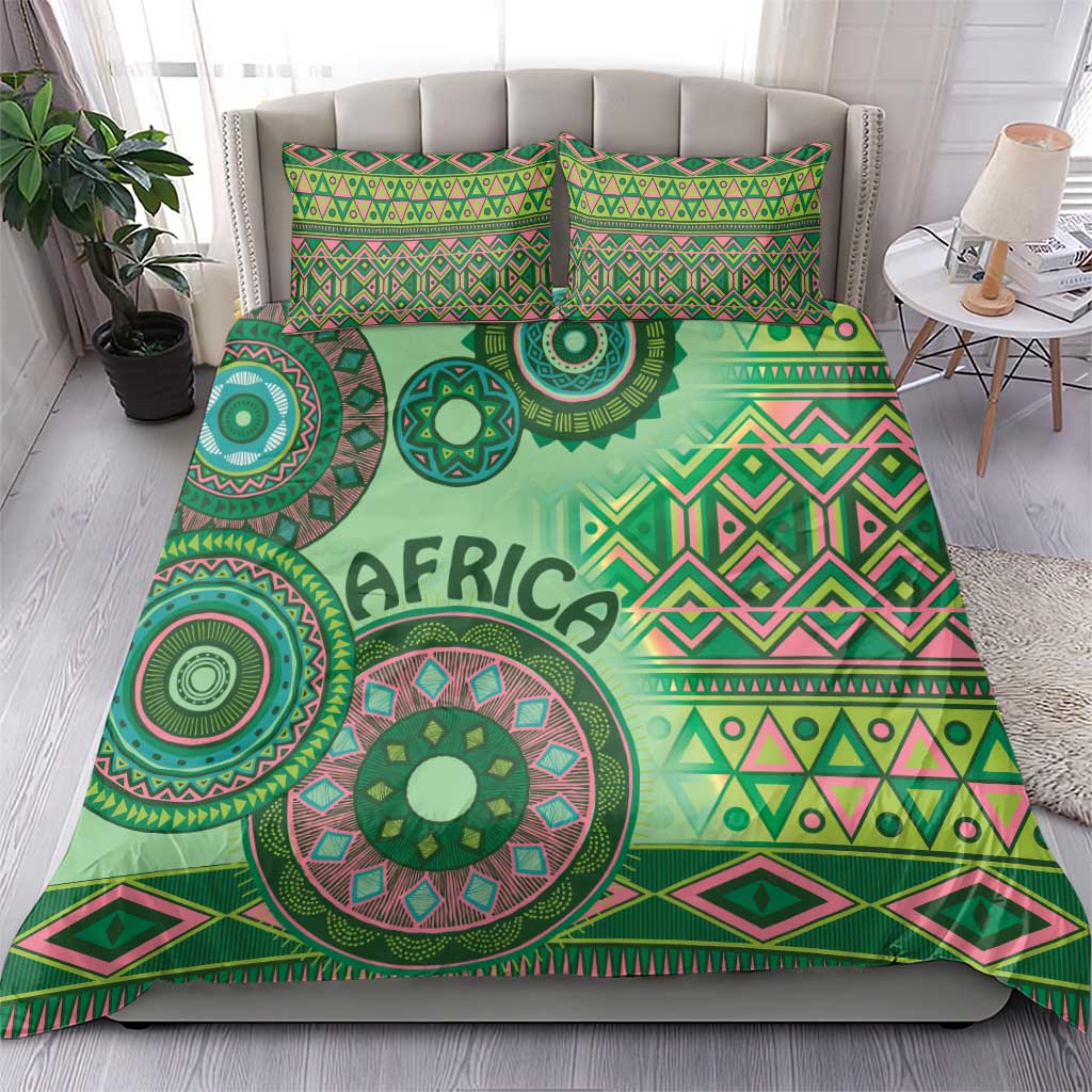 Green tribal bedding set on bed with duvet and two pillowcases, 'AFRICA' center motif