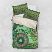 Green tribal bedding set with duvet and two pillowcases, shown from top view