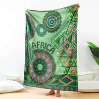 Green tribal pattern blanket with large circular mandala motifs and geometric borders