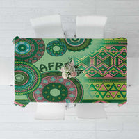 Green tribal pattern tablecloth with circular and diamond motifs, laid flat for view