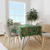 Green tribal geometric tablecloth on dining table with multicolor diamond motifs
