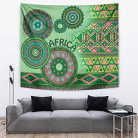 Green tribal tapestry with circular motifs, geometric border, and 'AFRICA' lettering