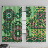 Green tribal curtain panels with bold circular prints and multicolor geometric rows