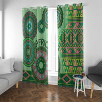 Green tribal curtains with circular prints and zigzag pattern bands on window