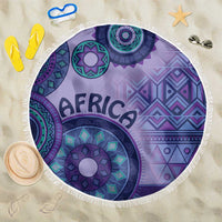 Purple round beach blanket with AFRICA lettering, tribal mandala print, white fringe edge