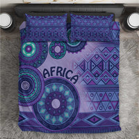Purple duvet set featuring geometric tribal print circles and two coordinating pillowcases