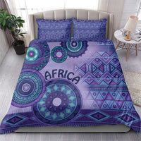Purple bedding set with large circular tribal artwork and “AFRICA” text on duvet