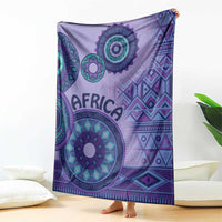 Purple tribal patterned blanket hanging with bold circular mandalas and diamond shapes