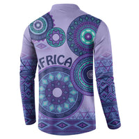 Purple henley sweatshirt back with teal tribal circular motifs and patterned sleeves