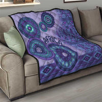 Purple tribal throw quilt on a sofa with teal circular motifs and "AFRICA" in the center