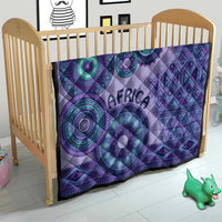 Purple quilt for a crib with teal circular patterns, geometric shapes, and "AFRICA" text