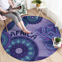 Purple round area rug featuring teal and purple circular motifs and AFRICA text