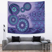 Purple African tribal tapestry with circular motifs in teal and pink tones