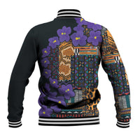 Back of floral and tribal patterned varsity baseball jacket, black with violet blooms and rib trim