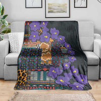 Dark blanket with purple flowers and colorful tribal patchwork pattern