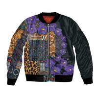 Violet and black bomber jacket with tribal geometric panels, leopard print, and purple flowers