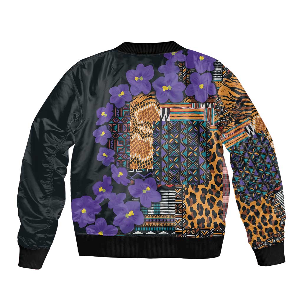Black bomber jacket with back tribal pattern, purple flowers, leopard texture, and geometric blocks