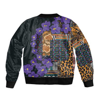 Black bomber jacket with back tribal pattern, purple flowers, leopard texture, and geometric blocks