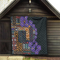 Black quilt with colorful tribal pattern, leopard print center, and purple flower vine
