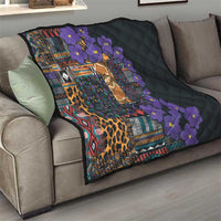 Black quilt on sofa with colorful tribal print, leopard pattern, and purple flower detailing
