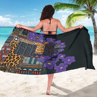 Tribal sarong with purple blossoms over black, leopard and pattern stripes