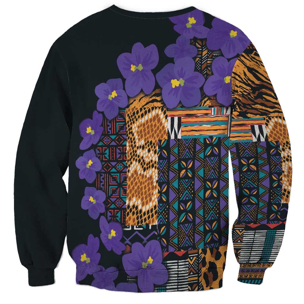 Unisex black sweatshirt with violet flowers and multicolor tribal patchwork back