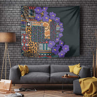 Wall-hung tapestry on brick: multicolor geometric pattern with leopard spots and purple blooms
