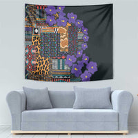 Wall tapestry with geometric tribal motifs, leopard print panels, and clustered purple flowers